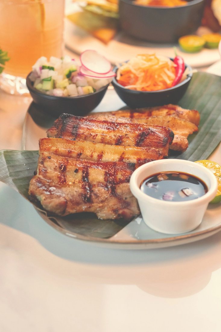 Inihaw na Liempo: grilled pork belly with atchara and a dipping sauce